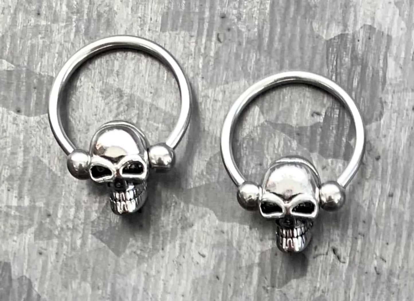 1 Piece Unique Skull 316L Surgical Steel Captive Bead Ring / Circular Barbell - Gauges 14g or 16g with a 1/2" internal diameter!