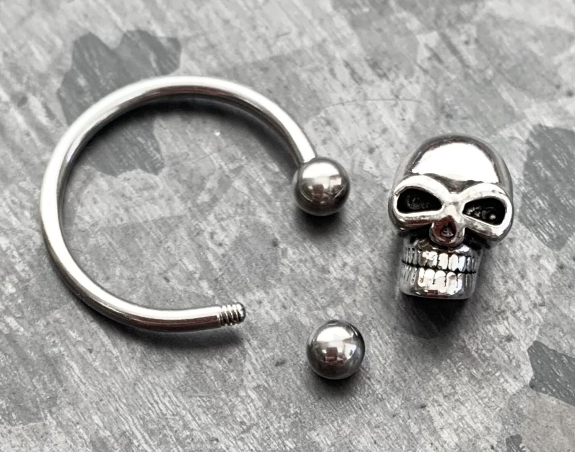 1 Piece Unique Skull 316L Surgical Steel Captive Bead Ring / Circular Barbell - Gauges 14g or 16g with a 1/2" internal diameter!