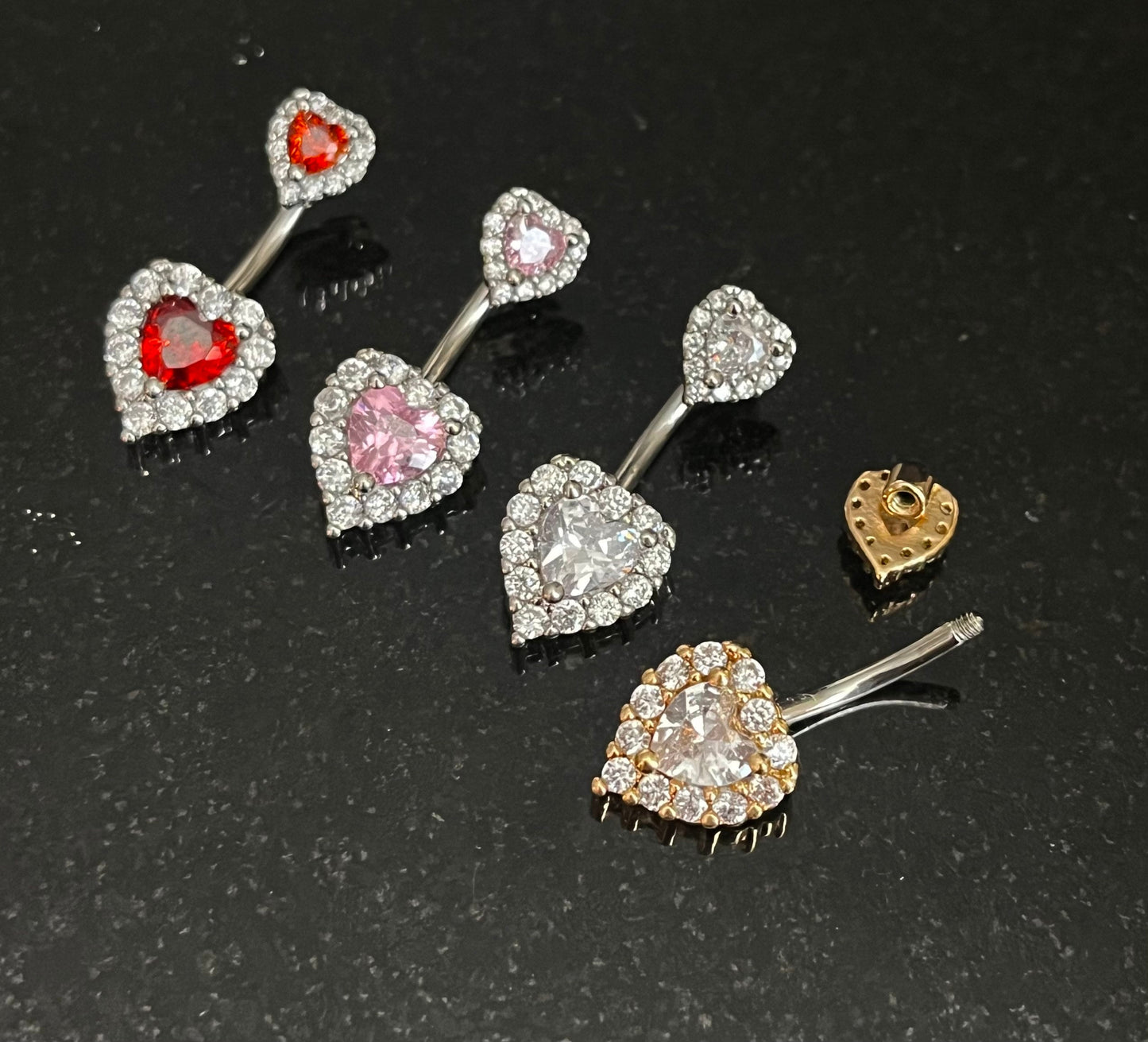 1 Piece Brilliant Gem Surrounded Hearts Button Ring Navel / Naval Belly Ring - 14g - 10mm - Available in Clear, Gold, Pink,and Red/Orange!